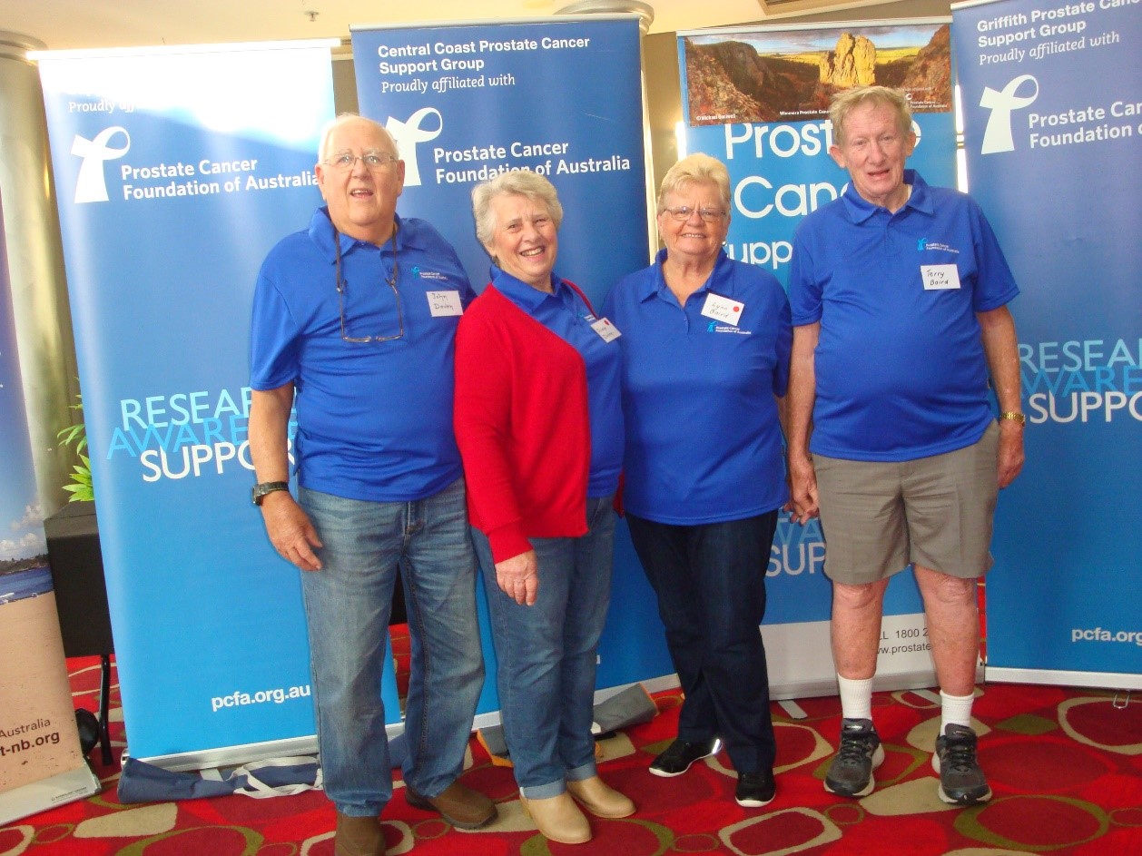 John & Diane Daven with Lynn & Terry Baird in front of their respective Support Group banners at this year’s Dubbo Conference.